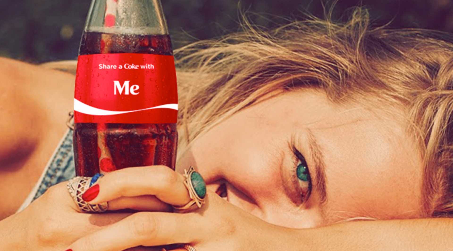 a girl holding a cocacola beverage