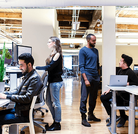 bounteous employees talking at desks