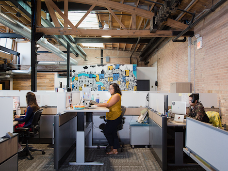 Employees working at the studio office