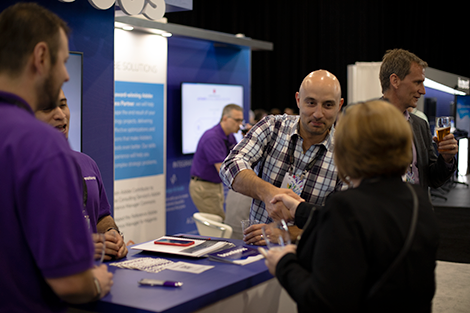 Bounteous employees talk with adobe summit attendees