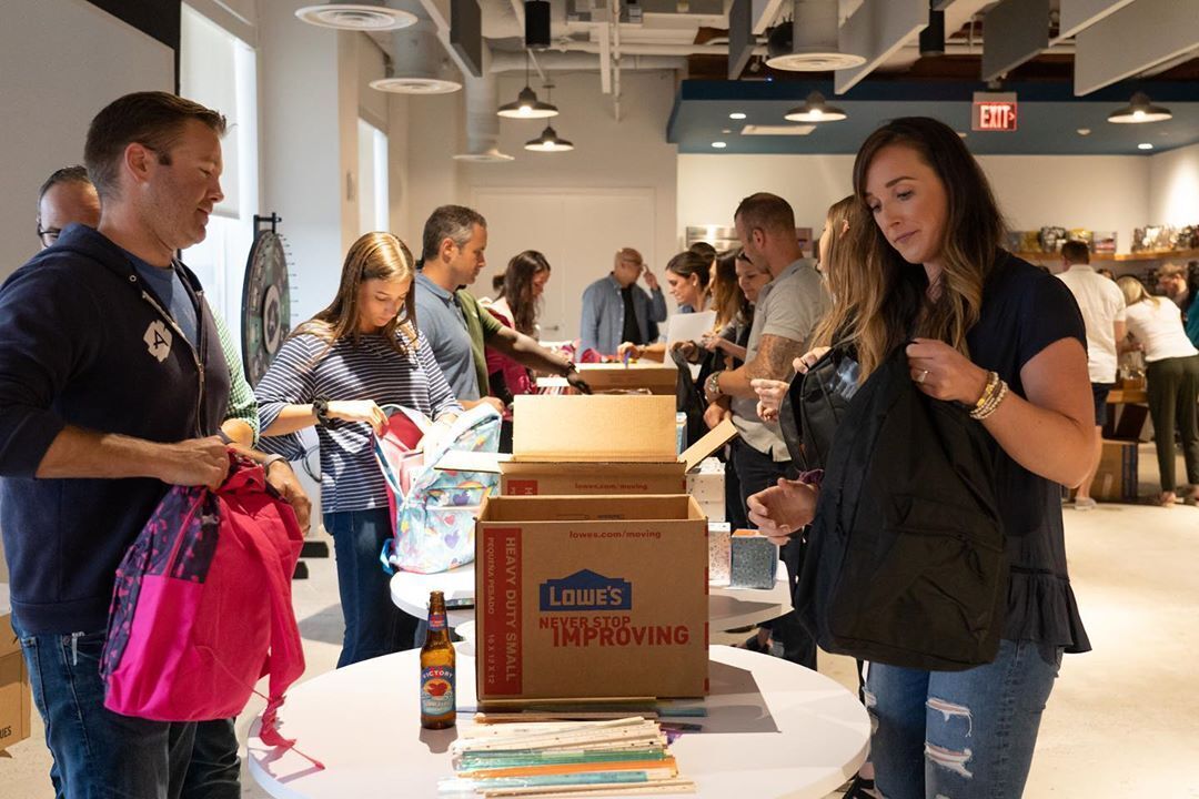 bounteous team members packing boxes for the food bank