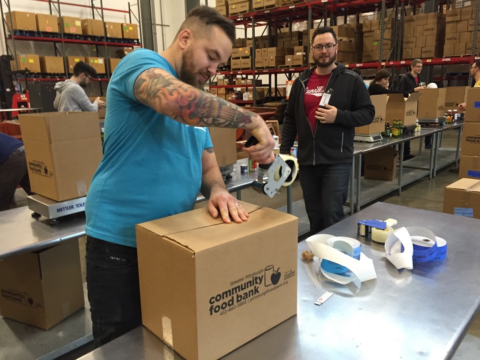 Bounteous team members packing boxes