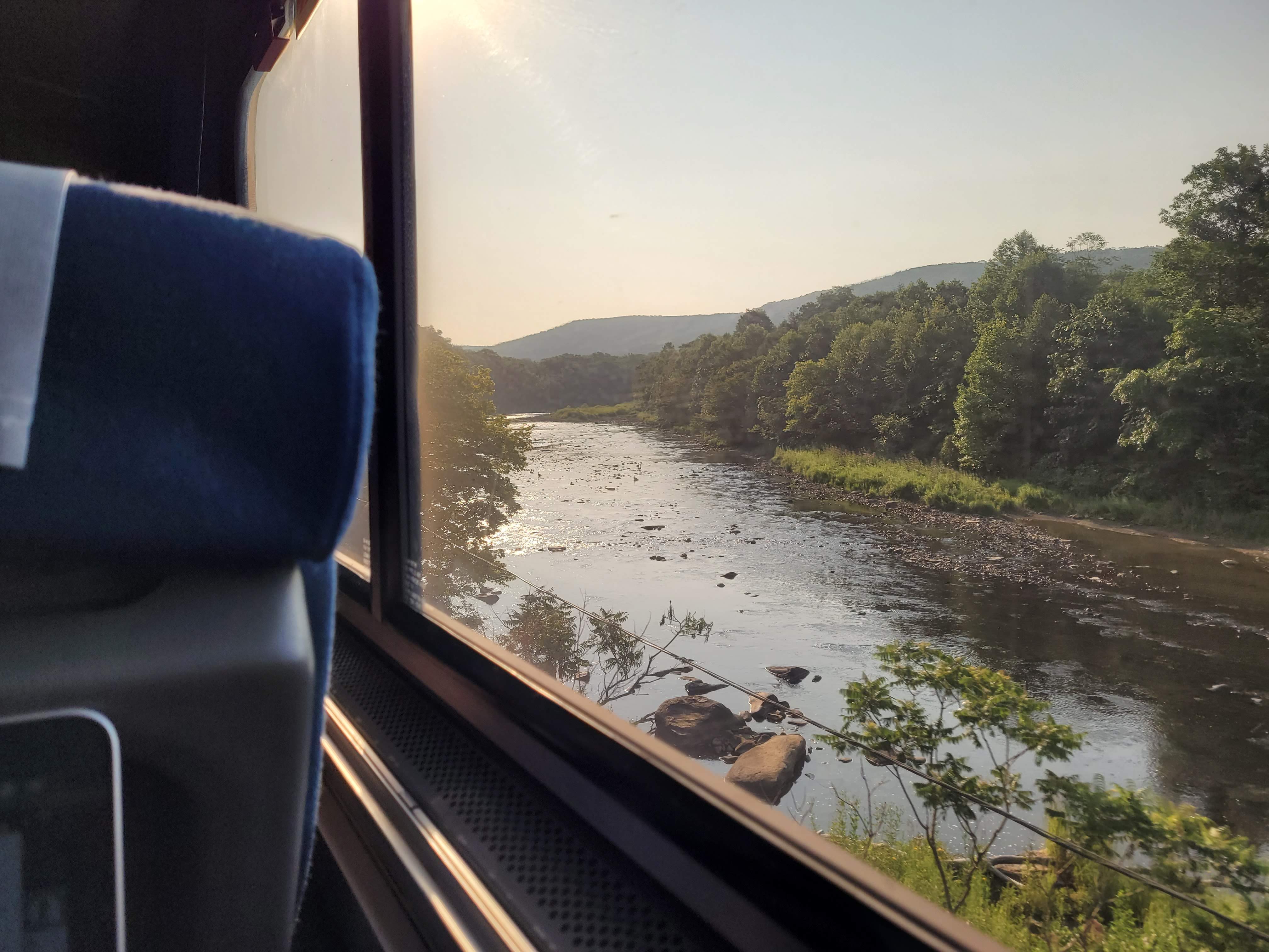 train driving over a river