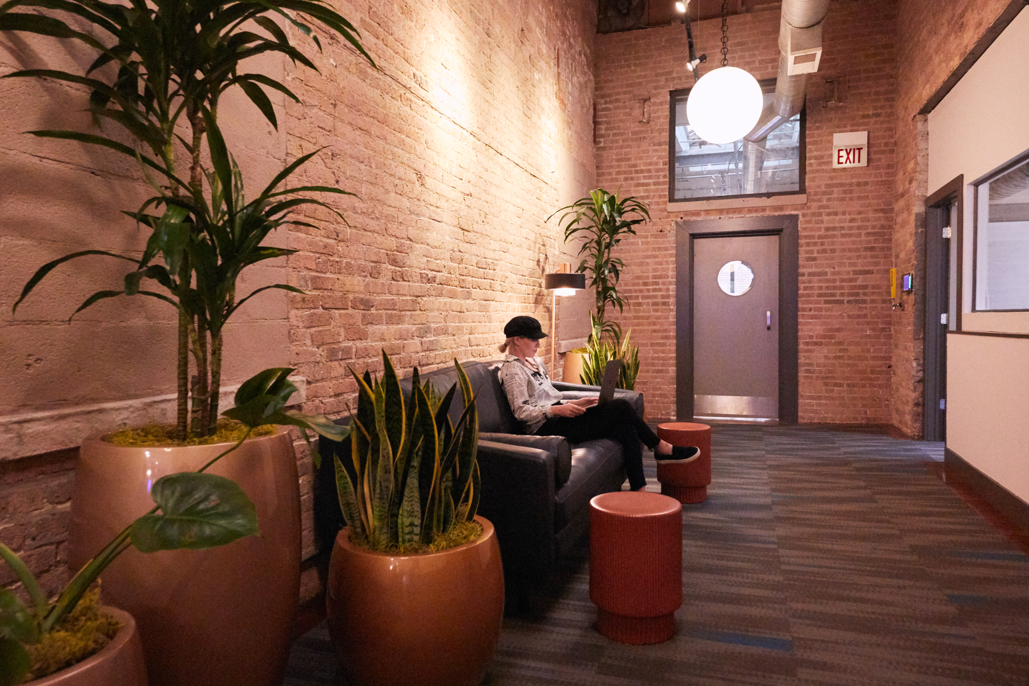 People sitting in the communal space at the Chicago office