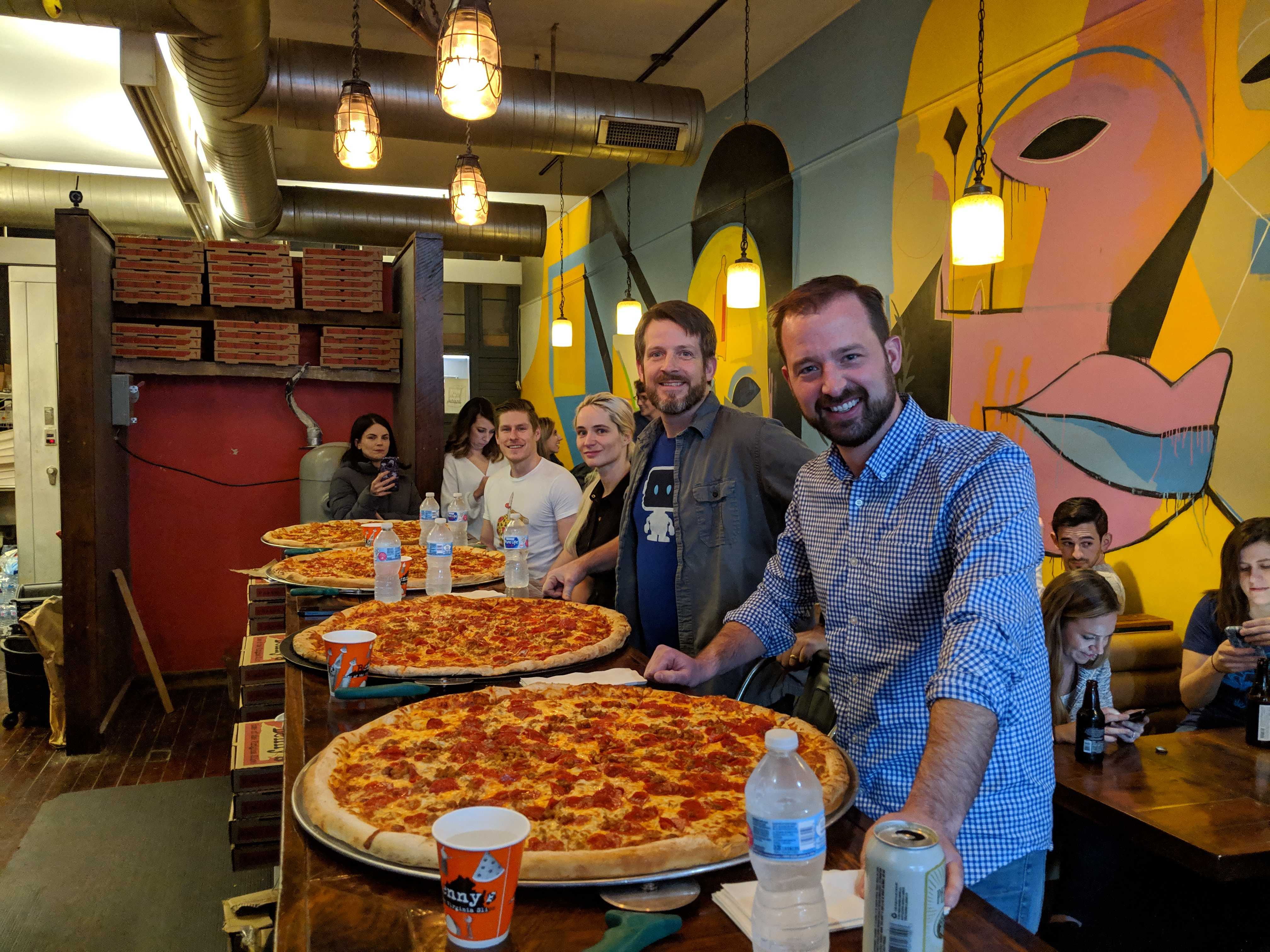 team members having a pizza eating contest
