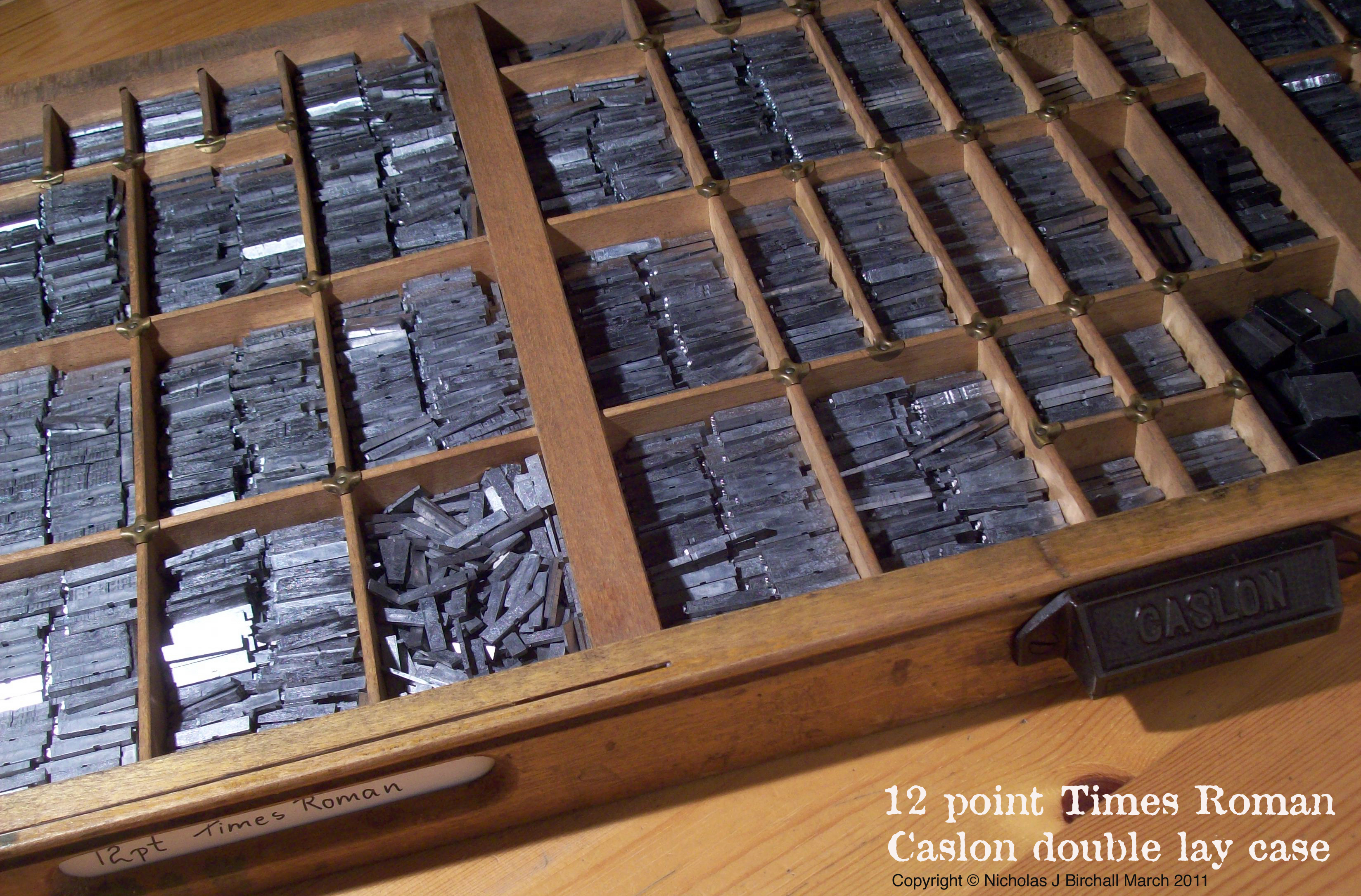 A type case, where metal sorts were stored in small compartments of drawers