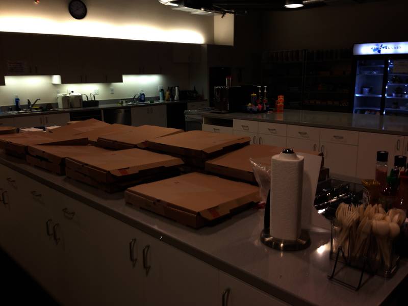pizza boxes laid out for tech meetup attendees