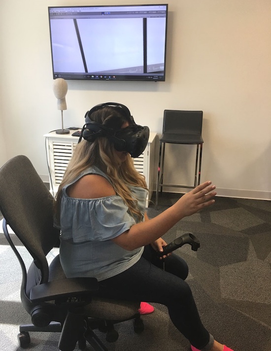 girl wearing vr equipment as part of a vr test