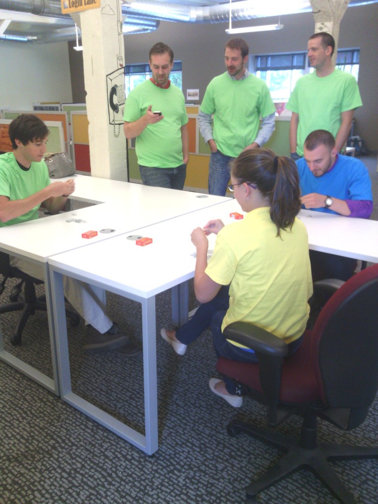 The LunaMetrics team competes in a paperclip chain-building challenge