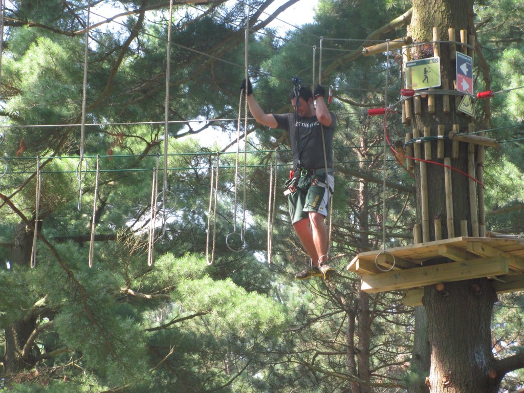 Stephen Kapusta completes a hoop-ring obstacle on the Go Ape! zipline and ropes challenge course