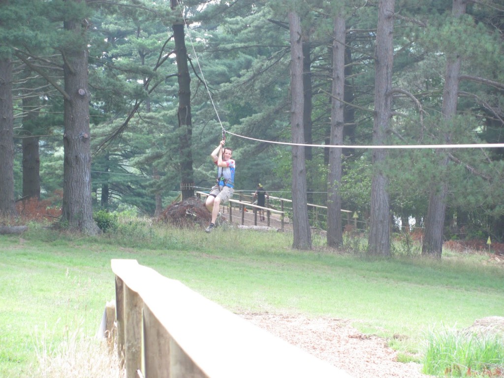 Jim Gianoglio flys down one of the giant ziplines between course obstacles Jim Gianoglio flys down one of the giant ziplines between course obstacles